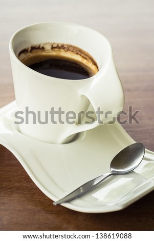 Black coffee in ceramic cup, curve design