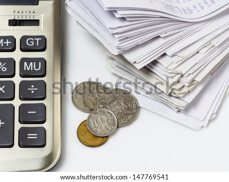 Australian coins with part of receipts and calculator