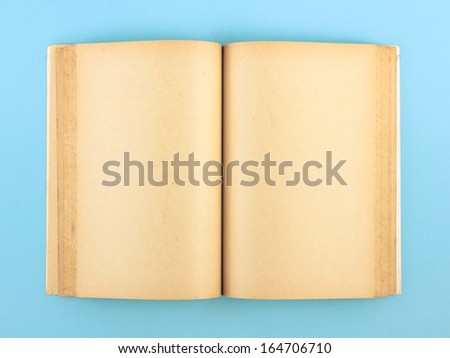 Blank pages of old book on blue paper background