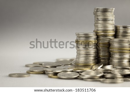 Heap and pile of coins with space for text