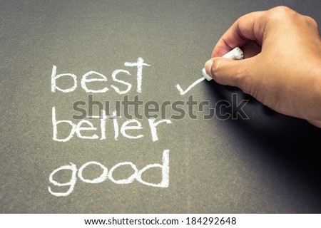 Hand writing correct mark with chalk on the best choice