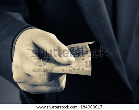 Closeup hand with Australian banknote