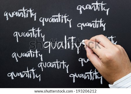 Hand writing Quality word in the center among the Quantity with chalk