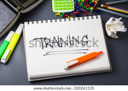 Handwriting of Training word in notebook on the desk