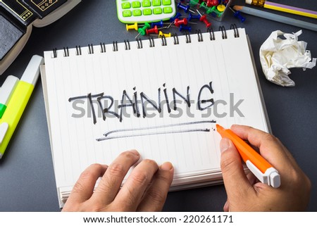 Handwriting of Training word in notebook on the desk