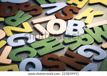 Job word in scattered wood letters