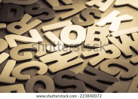Job word in scattered wood letters