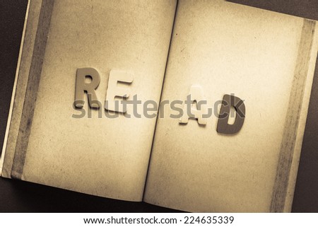 Opened old book with Read letters