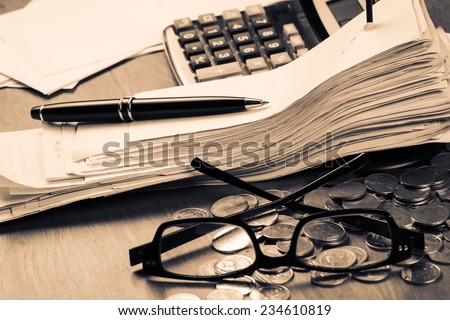 Receipts in paper nail on accountant desk