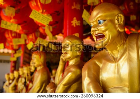 Gold priest statue in Chinese temple
