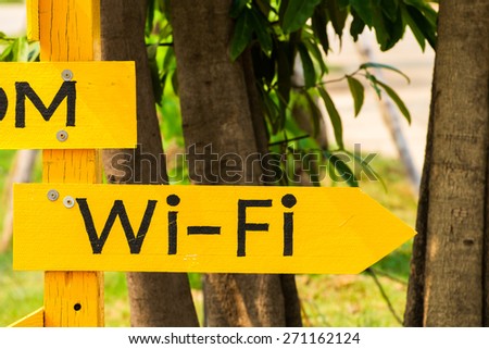 Wi-Fi spot turn right, wood sign post