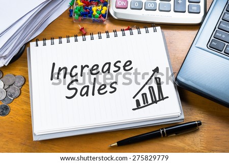 Increase Sales on notebook with part of laptop, receipts and calculator