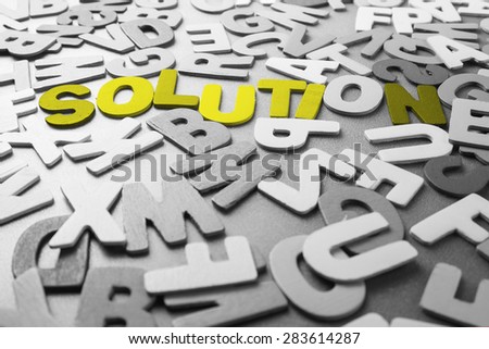 Color Solution word in scattered black and white wood letters