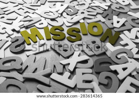 Color Mission word in scattered black and white wood letters