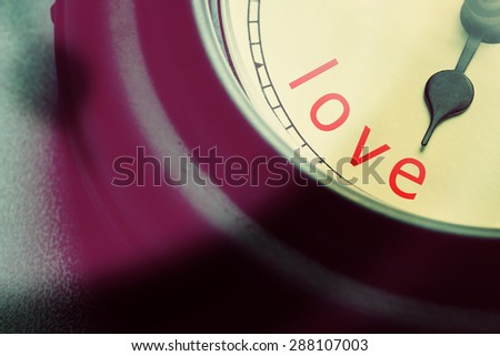 Time for Love, abstract clock hand at the Love word in retro color
