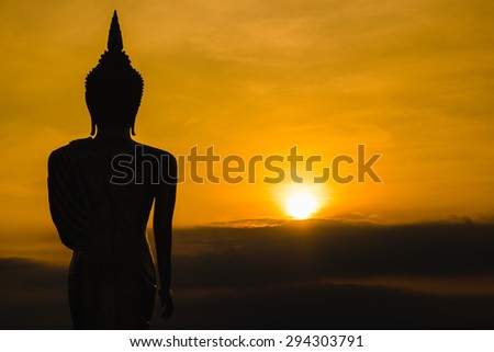 Silhouette Buddha Statue and sunrise in Nan province, northern of Thailand