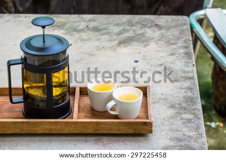Hot tea set on concrete table