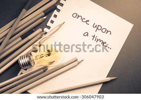 Once upon a time on paper with pencils and lightbulb