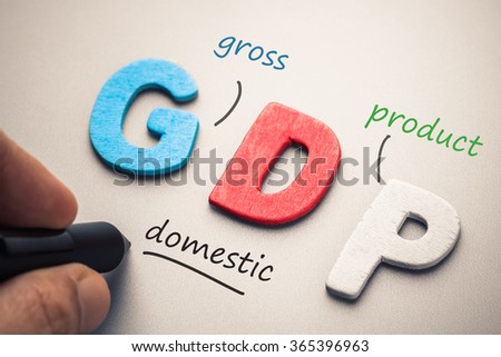 Wood letter of GDP abbreviation with hand writing definition