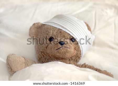 Photo of a teddy bear with bandage