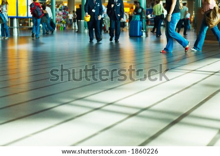 people at the airport with lots of copyspace