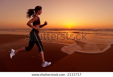 stock photo : woman running during sunset