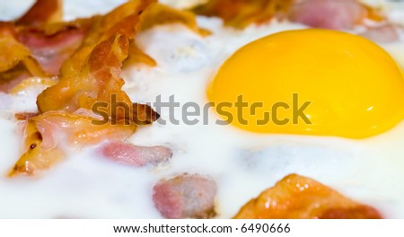 freshly cooked bacon and eggs