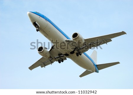 airplane on takeoff with blue sky background