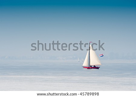 Ice sailing on the frozen lake (gouwzee Between Edam and Marken Netherlands)