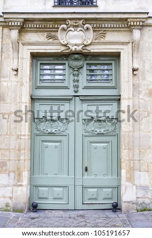 Historic wooden door, seen in Paris, France