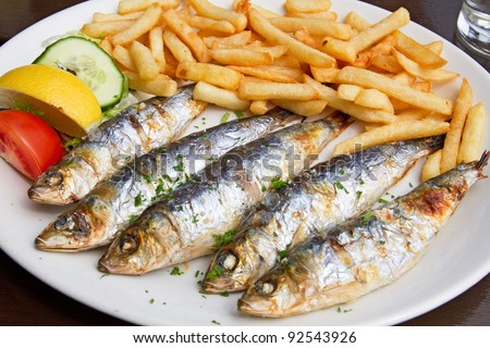 http://image.shutterstock.com/display_pic_with_logo/645541/645541,1326353092,2/stock-photo-grilled-sardine-fish-and-french-fries-served-on-a-plate-in-a-pub-92543926.jpg