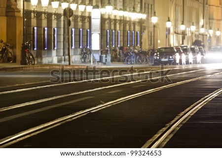 Tram rails in historic Munich, Germany, at night