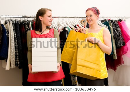 Customer with sales woman in clothing shop