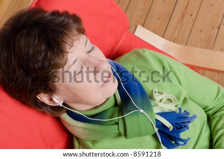Attractive woman listens to music.