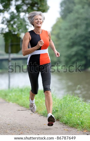 Active senior woman running