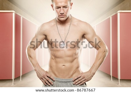 Young sportsman standing in changing room