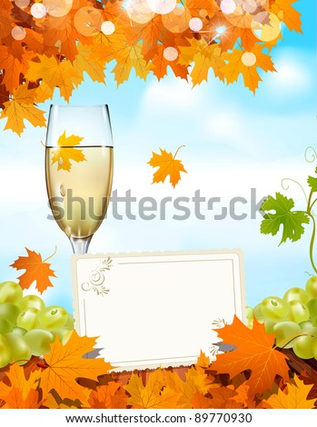 grapes and a glass of wine standing on a wooden table with a greeting card, the blue sky and autumn maple leaves (JPEG version)