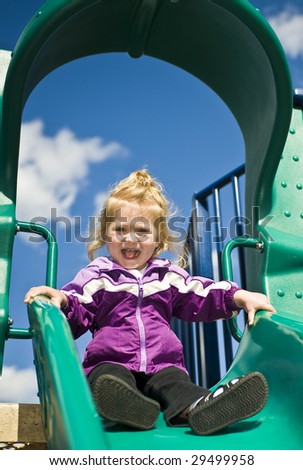 Girl at the top of the slide