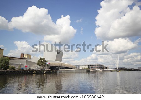 SALFORD QUAYS - JUNE 19: View of the Imperial War Museum and Media Bridge, June 19, 2012 in Slaford Quays, England. Future plans aim to spread the success of Salford Quays\' regeneration into other parts of Salford in 2012