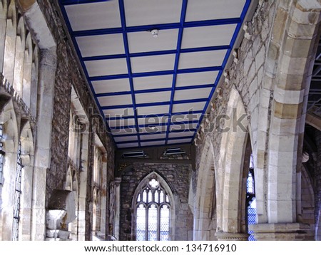 YORK, UK - APRIL 4: East aisle and stained glass window in York St. Mary\'s Church on April 4, 2013 in York. The church is currently displaying the shortlisted works for the Aesthetica Art Prize.