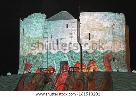 YORK, UK - OCTOBER 2013: Clifford Tower, York, UK, 30 October 2013. York. Illuminating York is spread right across the city centre with 11 brand new illuminating artworks being presented this month.
