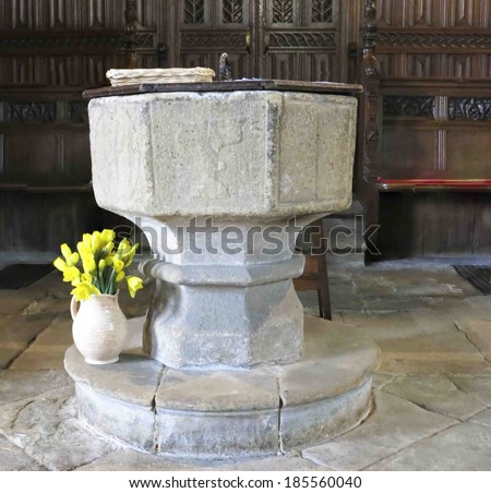 TIDESWELL, UK - MARCH 2014: Font, St John the Baptist, Tideswell, Peak District, 30 March 2014. The magnificent 14th century church is known as the \