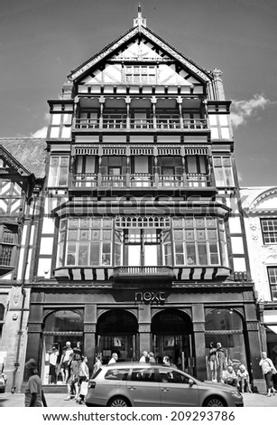 CHESTER, CHESHIRE - AUGUST 4, 2014: Shop frontage. Chester has a number of medieval buildings, but some of the black-and-white buildings within the city centre are Victorian restorations