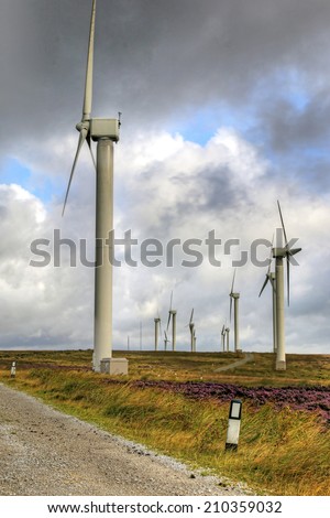 HALIFAX, WEST YORKSHIRE - AUGUST  11, 2014: The 23 turbines of Ovenden Moor wind farm are supplying sustainable clean, green power and have now been doing for over 15 years.