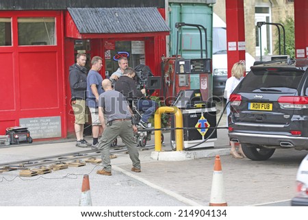RIPPONDEN, WEST YORKSHIRE - SEPTEMBER 3 2014: Film crew filming a scene for  comedy TV series at the local petrol station in Ripponden