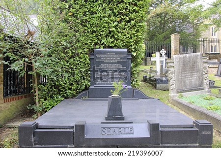 HIGHGATE, LONDON - SEPTEMBER 23, 2014:  Headstone. Highgate Cemetery is notable both for some of the famous people buried there as well as for its status as a nature reserve.