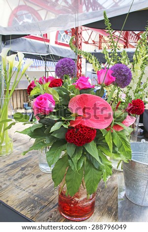 ALTRINCHAM, UK - JUNE 7 2015: Flowers on a stall at Altrincham market, Manchester. Altrincham is a market town in Trafford, Greater Manchester and an affluent commuter town