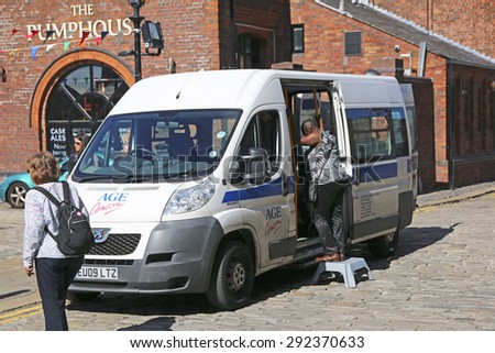 LIVERPOOL, UK - JUNE 30, 2015: Carers van for wheel bound visitors to the Maritime Museum, Liverpool. Liverpool is a city in Merseyside, England, on the eastern side of the Mersey Estuary