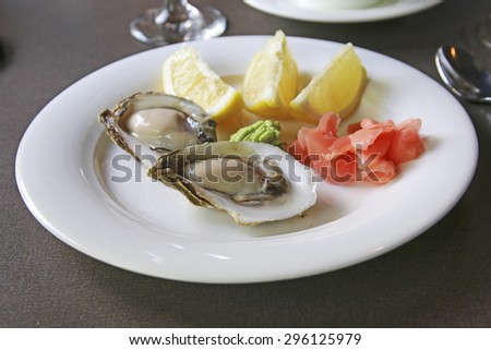 Oysters with lemon, pickled ginger and wasabi paste