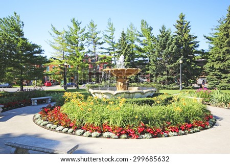 HAMILTON, ONTARIO - JULY 20, 2015: Fountain in garden outside LIUNA station, Hamilton. Hamilton is the centre of a densely populated and industrialized region at the west end of Lake Ontario